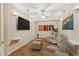 Home theater room with comfortable seating and large TV at 2145 Sugarstone Ct, Lawrenceville, GA 30043
