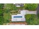Aerial view of a home with solar panels, landscaped yard, and a long driveway at 407 Westside Dr, Roswell, GA 30075