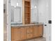 Bathroom vanity with double sinks, granite countertops, and custom wooden cabinetry with shelving at 407 Westside Dr, Roswell, GA 30075