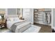 Cozy bedroom with stylish rug and closet featuring built-in shelving for storage at 407 Westside Dr, Roswell, GA 30075