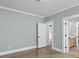 A bright bedroom offers an open doorway to the bathroom, providing an en suite feel for added convenience at 407 Westside Dr, Roswell, GA 30075