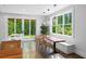 Bright dining area with large windows, modern lighting, and access to the outdoors at 407 Westside Dr, Roswell, GA 30075