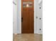 A classic wooden front door with glass panes offers a warm welcome to this home at 407 Westside Dr, Roswell, GA 30075