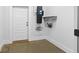 A functional garage space with white door and vacuum system for added convenience at 407 Westside Dr, Roswell, GA 30075