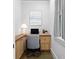 Cozy home office with custom built-ins, a comfortable chair, and a bright window at 407 Westside Dr, Roswell, GA 30075