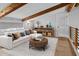 Cozy living room with exposed wood beams, comfortable seating, and stylish decor at 407 Westside Dr, Roswell, GA 30075