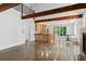 Spacious living area with exposed beams and an open layout connecting to the kitchen at 407 Westside Dr, Roswell, GA 30075