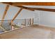 Spacious loft area with exposed wooden beams and metal railings overlooking the living space at 407 Westside Dr, Roswell, GA 30075