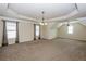 Spacious bonus room with neutral carpet, great natural light and recessed lighting at 7790 Stratford Ln, Atlanta, GA 30350