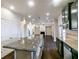 Open kitchen with granite countertops island with pendant lighting that leads to the living room at 7790 Stratford Ln, Atlanta, GA 30350