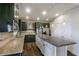 Spacious kitchen with granite countertops, stainless steel appliances, and dark wood cabinetry at 7790 Stratford Ln, Atlanta, GA 30350