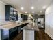 Spacious kitchen with granite countertops, stainless steel appliances, and dark wood cabinetry at 7790 Stratford Ln, Atlanta, GA 30350