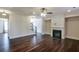 Bright living room featuring hardwood floors, fireplace, large windows, and neutral paint colors at 7790 Stratford Ln, Atlanta, GA 30350