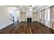 Bright living room featuring hardwood floors, fireplace, large windows, and neutral paint colors at 7790 Stratford Ln, Atlanta, GA 30350