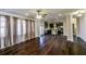 Open living room concept that flows to the kitchen. Hardwood floors with natural light and neutral color scheme at 7790 Stratford Ln, Atlanta, GA 30350