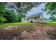Expansive backyard with lush greenery surrounds this charming home, offering privacy and space at 40 Heather Woods Ct, Covington, GA 30016