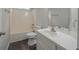 Bathroom showcasing a vanity with a white sink, tile flooring, and a tub with a shower at 40 Heather Woods Ct, Covington, GA 30016