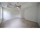 Spacious room with plush carpeting, recessed ceilings, and neutral color palette at 40 Heather Woods Ct, Covington, GA 30016