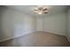 Neutral bedroom boasting soft carpet, modern ceiling fan, and fresh paint at 40 Heather Woods Ct, Covington, GA 30016