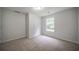 Cozy bedroom features neutral walls, carpet floors, and window at 40 Heather Woods Ct, Covington, GA 30016