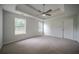 Large bedroom with carpet, natural light from windows, and a ceiling fan at 40 Heather Woods Ct, Covington, GA 30016