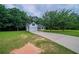 Traditional-style home with well-maintained lawn, long driveway, and attached two-car garage at 40 Heather Woods Ct, Covington, GA 30016