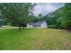 Charming single story home with a well-manicured lawn and mature trees at 40 Heather Woods Ct, Covington, GA 30016