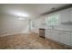 Modern kitchen featuring white cabinets, stainless steel appliances, and bright natural light at 40 Heather Woods Ct, Covington, GA 30016