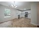 Bright and modern kitchen featuring white cabinetry, stainless steel appliances and modern lighting at 40 Heather Woods Ct, Covington, GA 30016