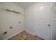 Laundry room provides ample space for machines, featuring durable tile flooring and clean white walls at 40 Heather Woods Ct, Covington, GA 30016