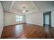 Spacious living room with hardwood floors, ceiling fan and neutral colored walls at 40 Heather Woods Ct, Covington, GA 30016