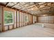 Spacious unfinished basement with multiple windows for natural light at 5662 Valley Loop, Fairburn, GA 30213