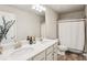 Bright bathroom with double sinks, modern fixtures, a vanity and a shower/tub combination at 5662 Valley Loop, Fairburn, GA 30213