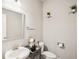 Elegant half bathroom with white sink and decorative accents at 5662 Valley Loop, Fairburn, GA 30213