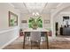 Cozy dining area with natural light, stylish decor, and wood-look floors, perfect for intimate gatherings at 5662 Valley Loop, Fairburn, GA 30213