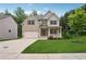 Charming two-story home with brick and siding, a well-manicured lawn, and a welcoming front porch at 5662 Valley Loop, Fairburn, GA 30213