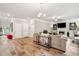 Expansive living room featuring a fireplace, comfortable seating, and bright, natural light from multiple windows at 5662 Valley Loop, Fairburn, GA 30213