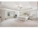 Spacious main bedroom with tray ceiling, large windows and neutral decor, creating a serene atmosphere at 5662 Valley Loop, Fairburn, GA 30213