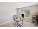 Bright office space with ergonomic seating and a large window providing ample natural light at 5662 Valley Loop, Fairburn, GA 30213