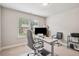 Well-lit office space with a large window, ergonomic seating and ample workspace at 5662 Valley Loop, Fairburn, GA 30213