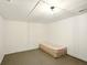 Unfinished basement with painted walls and floor, offering potential for customization and additional living space at 6126 Knights Ln, Douglasville, GA 30135