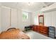 This bedroom features a twin bed, dresser, and window for natural lighting at 6126 Knights Ln, Douglasville, GA 30135
