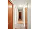 Well-lit hallway featuring hardwood doors at 6126 Knights Ln, Douglasville, GA 30135