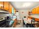 Functional kitchen featuring stainless steel appliances, ample cabinet space, and a dining area, offering practicality and convenience at 6126 Knights Ln, Douglasville, GA 30135