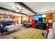 Eclectic living room featuring wood-paneled walls, exposed beams, and unique decor, creating a cozy and character-filled space at 6126 Knights Ln, Douglasville, GA 30135