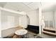 Living area features a futon, unique divider, and a view into the unfinished basement at 6126 Knights Ln, Douglasville, GA 30135