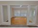 Open-concept living room with hardwood floors and view into carpeted living space at 983 Noble Oak Ct, Lawrenceville, GA 30046
