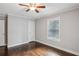 Bedroom with hardwood floors, large window, and neutral paint at 1735 Jobeth Se Ave, Atlanta, GA 30316