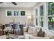 Bright dining area adjacent to living room, featuring windows and stylish decor at 1735 Jobeth Se Ave, Atlanta, GA 30316