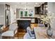 Open layout showing the kitchen island, dining area, and stainless steel appliances for a modern living experience at 1735 Jobeth Se Ave, Atlanta, GA 30316